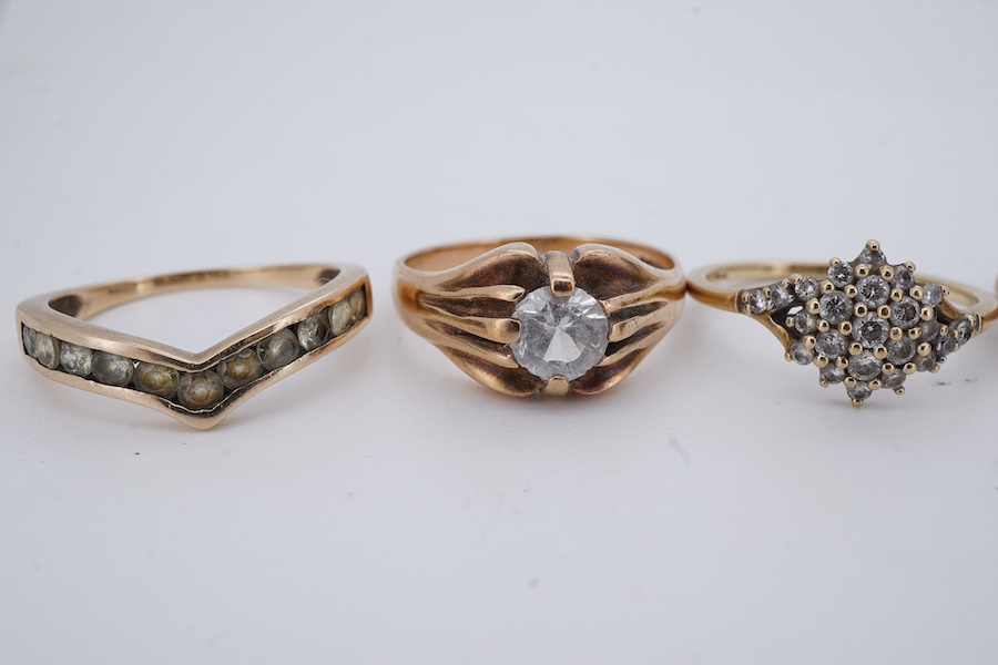 Six gem-set rings, comprising: one set with brilliant-cut diamonds; four set with colourless simulant diamonds; and one set with circular-cut peridots, each mounted in 9ct gold, British hallmarks, combined gross weight a